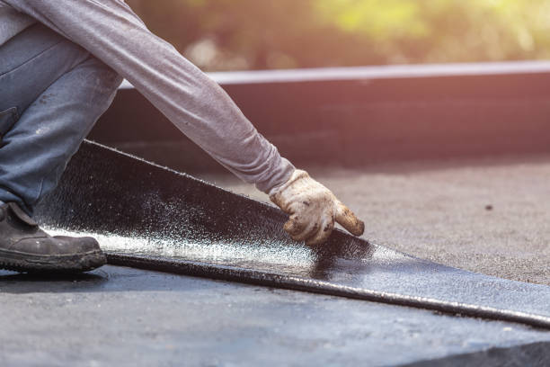 Professional Exterior Waterproofing technician working in Woodmere, NY